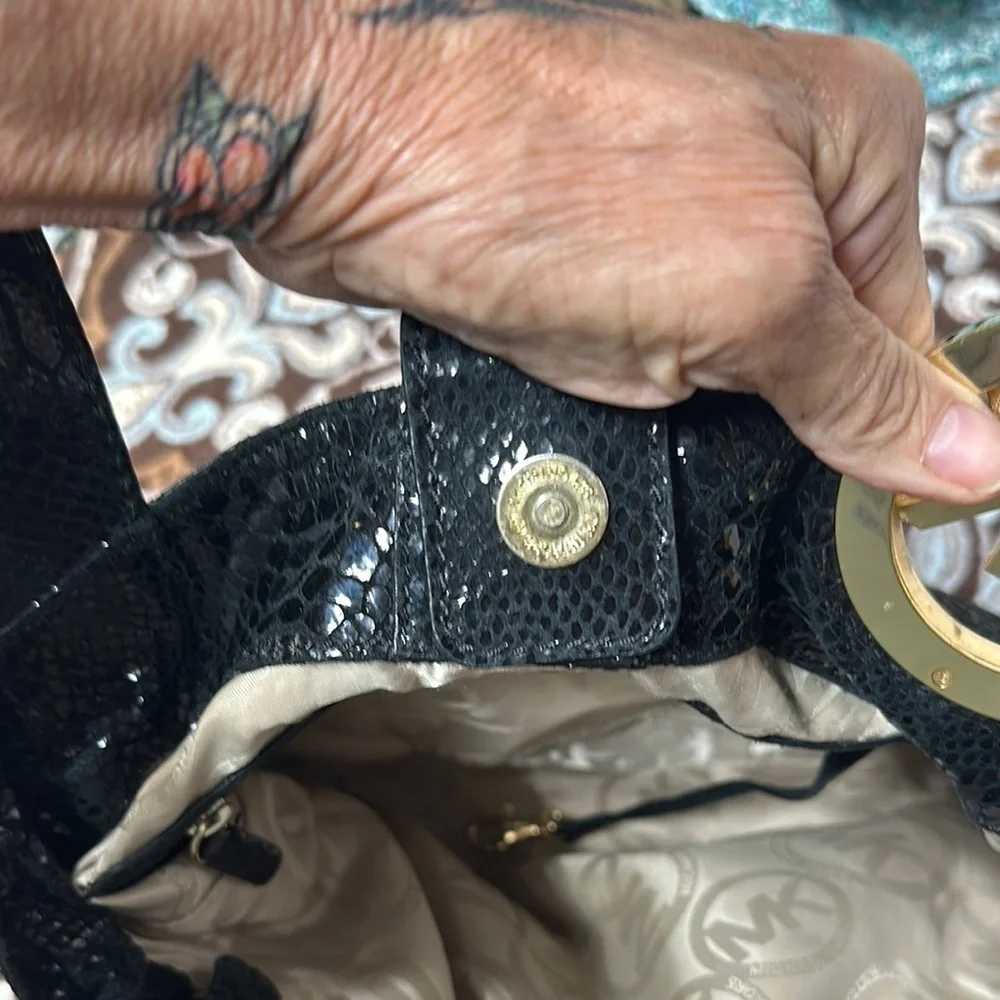 Michael Kors Black Hobo Bag with Gold Emblem